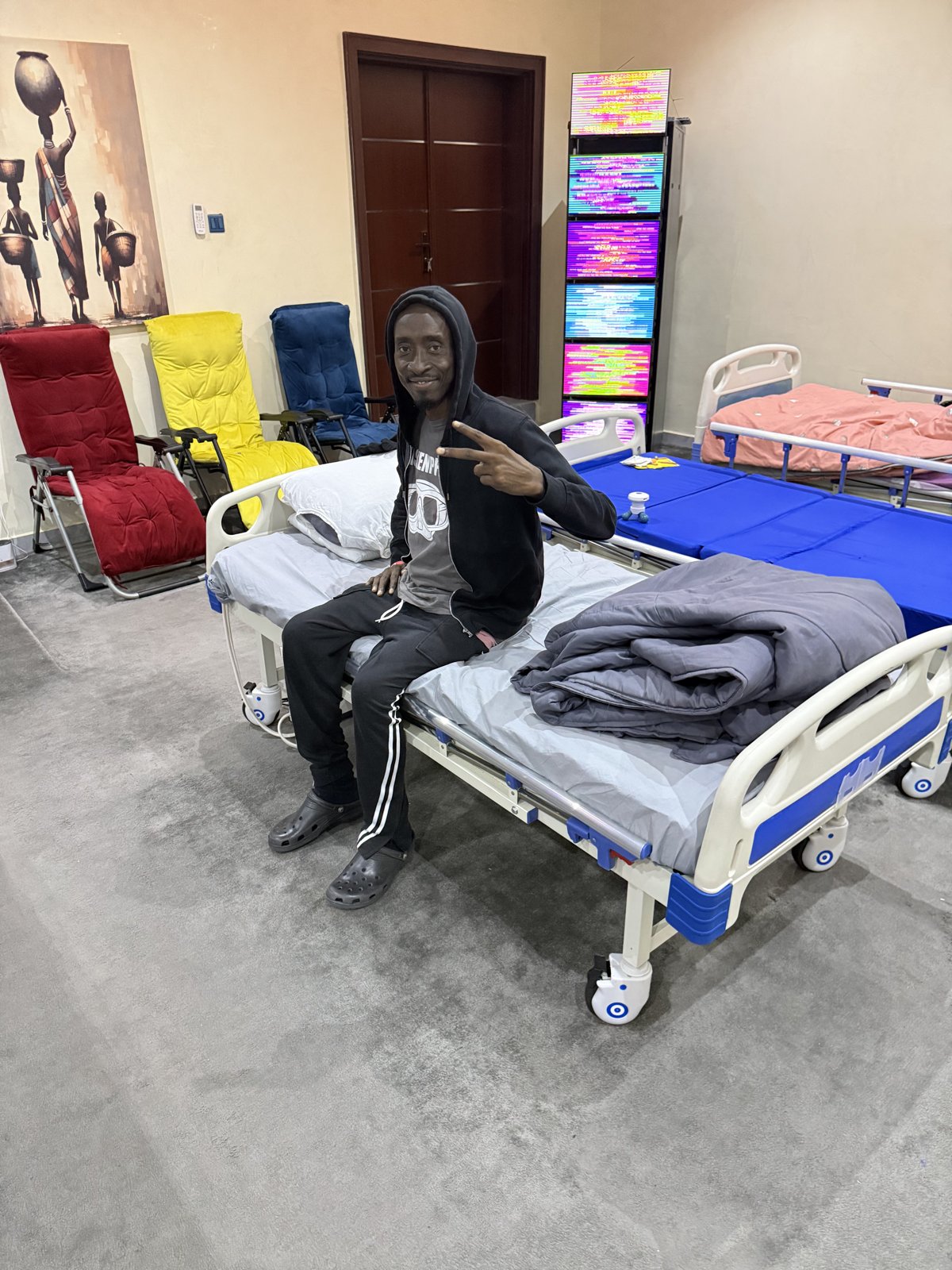 Guest relaxing in the EESystem room at Scalar Energy Wellness Centre